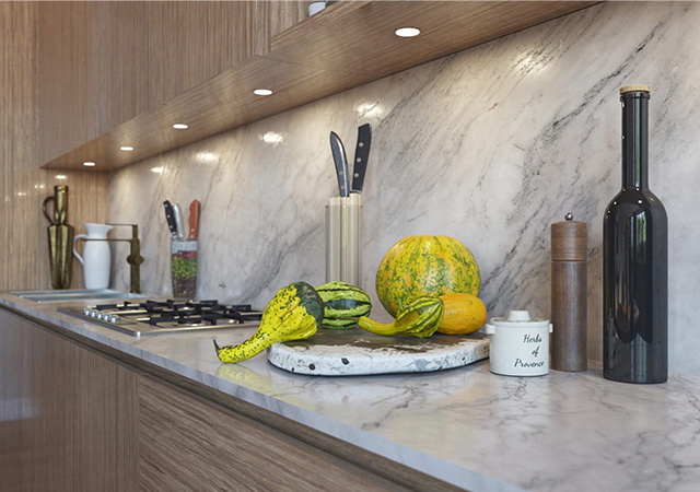 A modern kitchen with a stylish worktop, decorated with fresh vegetables and elegant kitchen utensils.